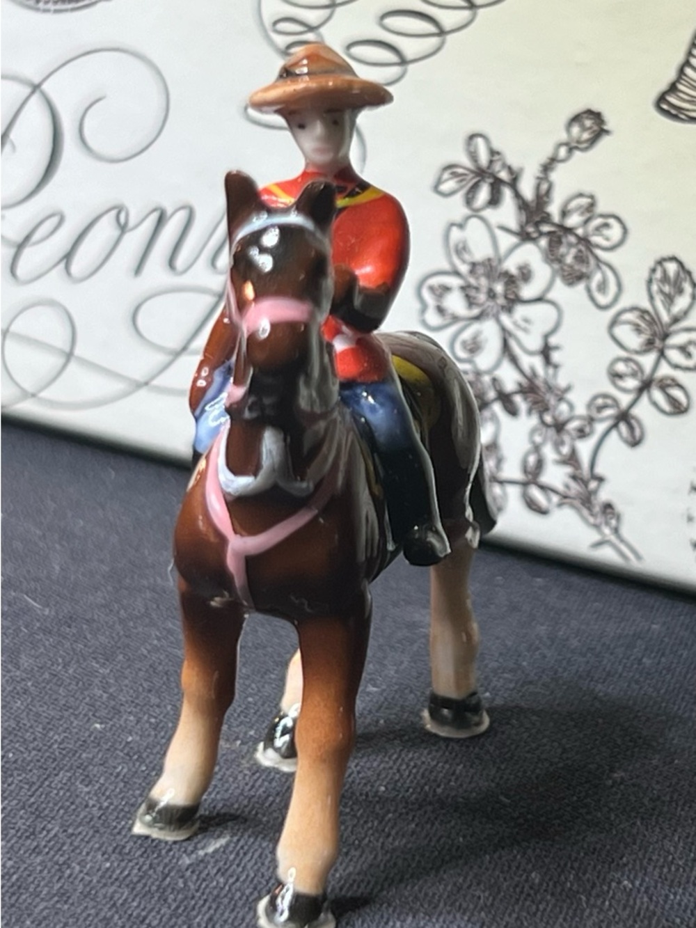 Vintage Miniature Ceramic Canadian Mountie Figurine in Brown and Red
